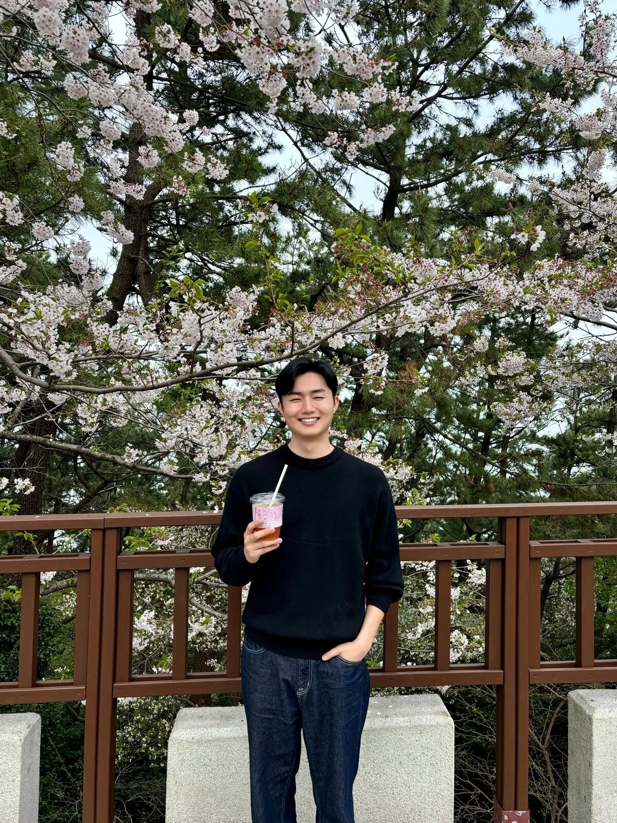 Hoon under cherry blossoms in Korea