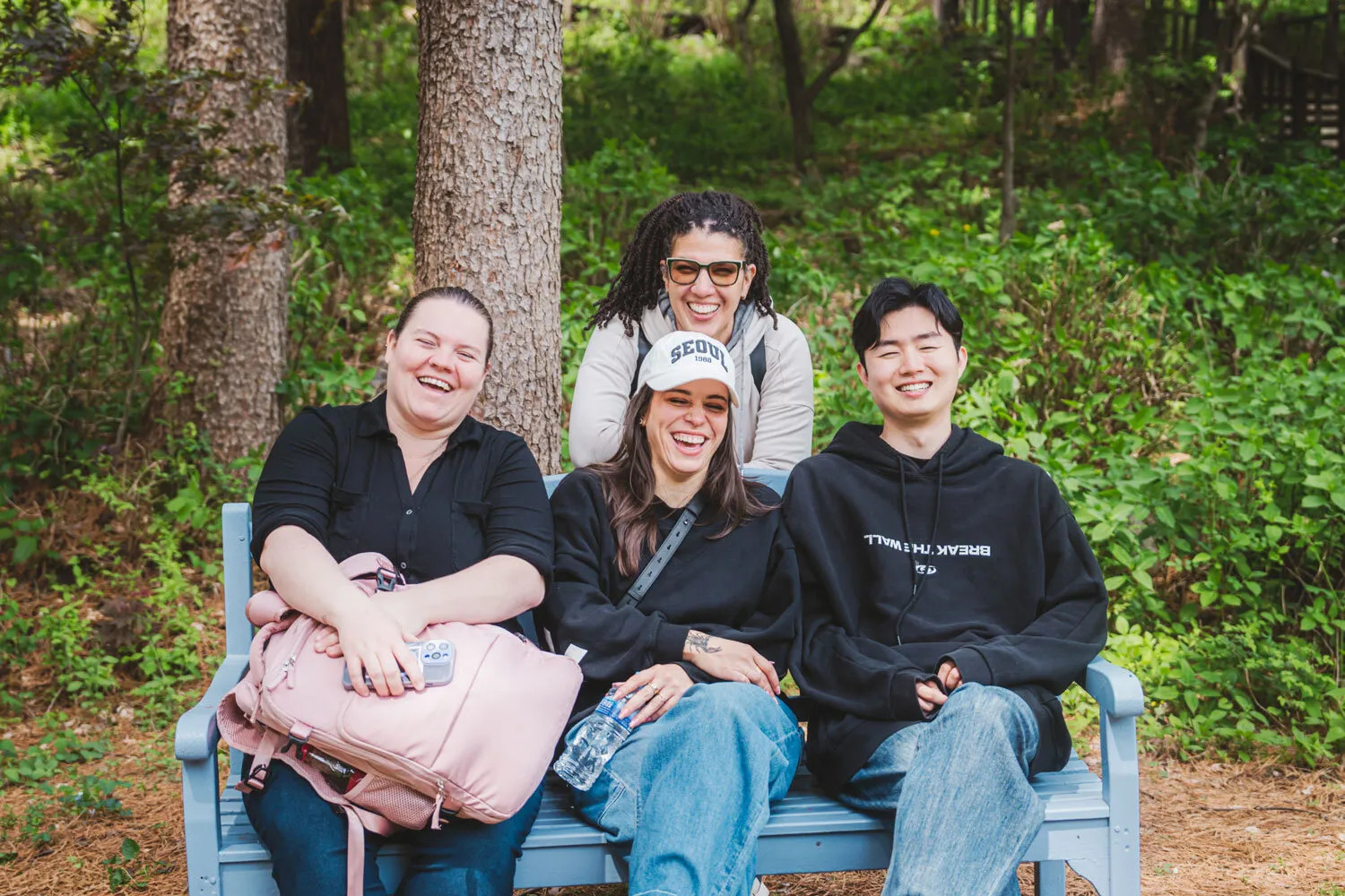 Hoon smiling with students
