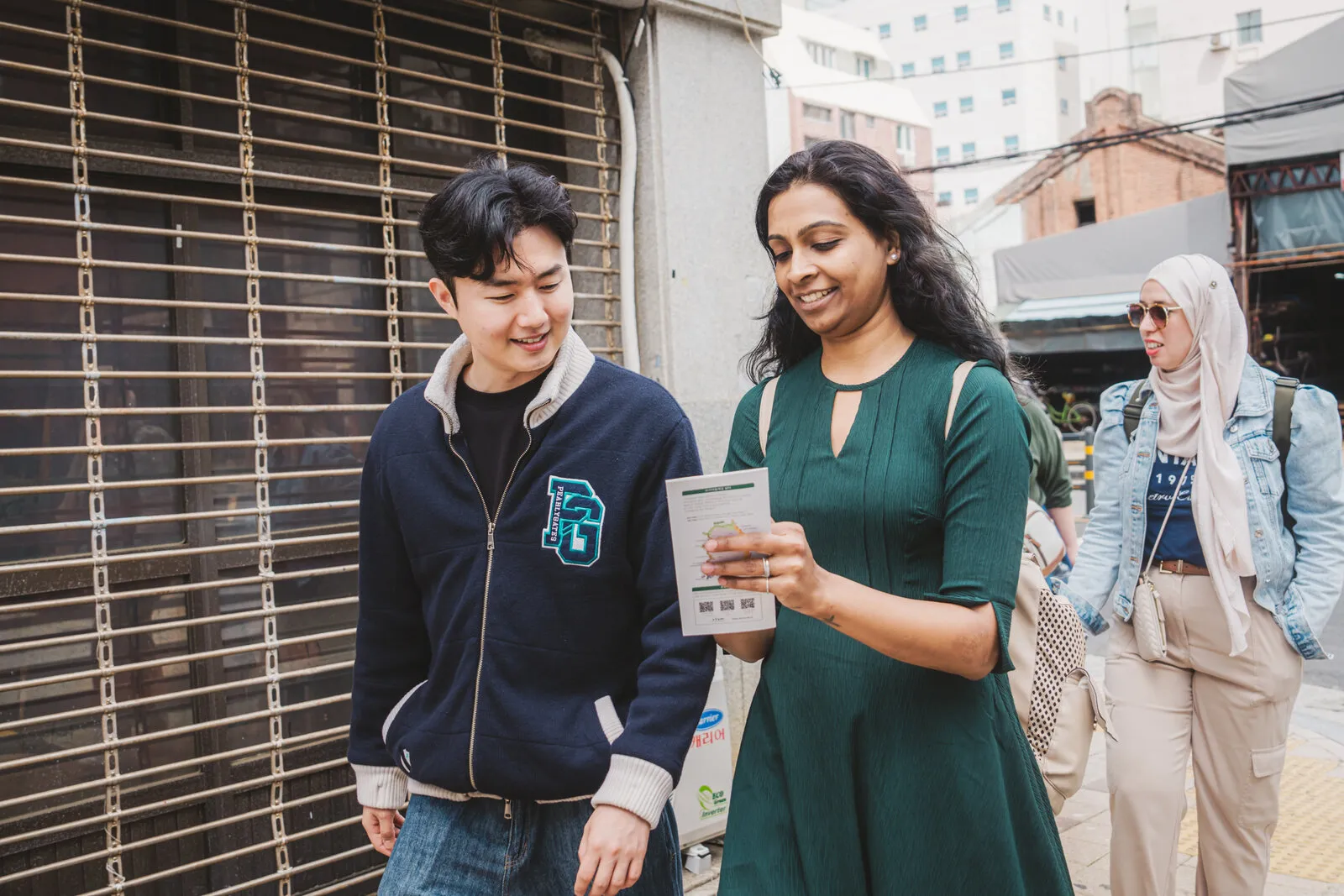 Hoon talking with a student
