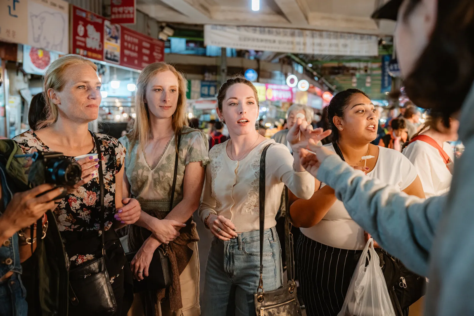 Students eating at a Korean market