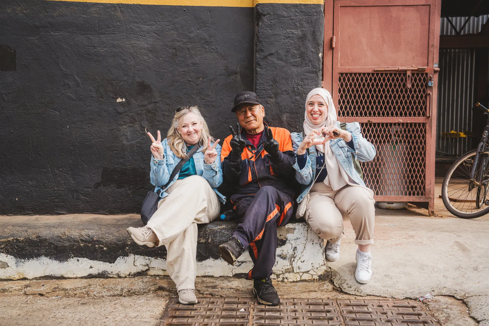 Students chatting with a local on the street